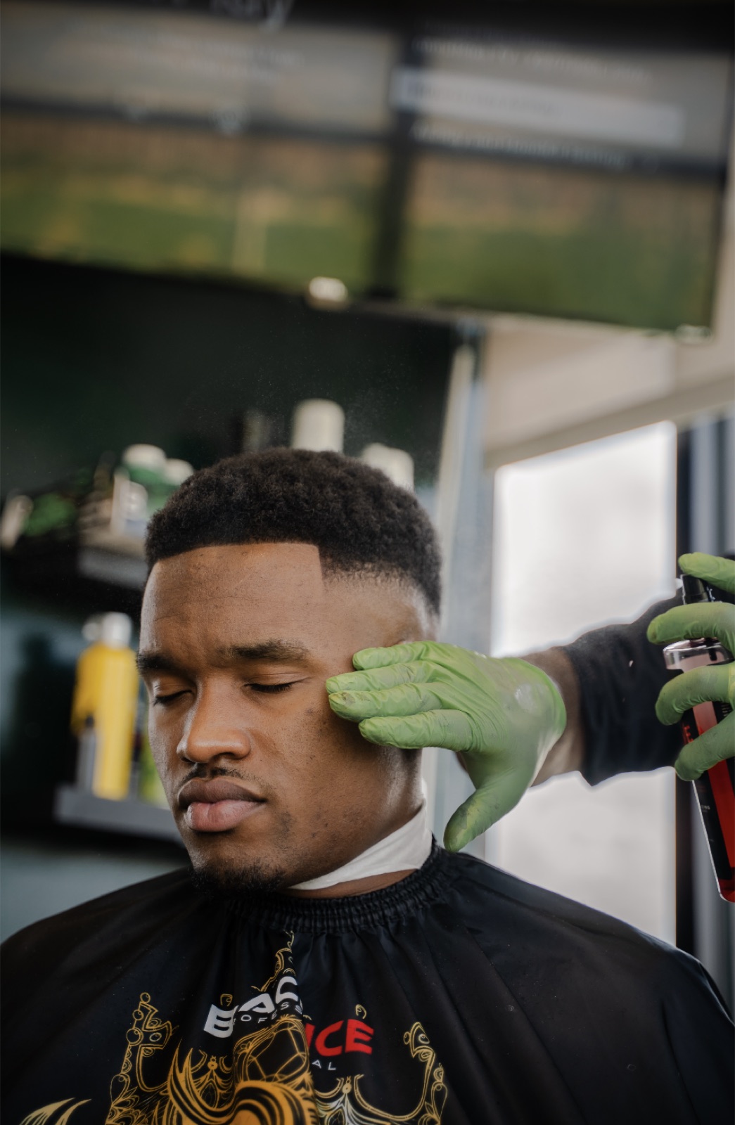 Finishing spray on a fresh fade